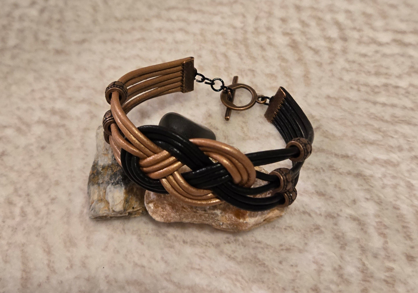 Rose gold and black celtic knot leather bracelet