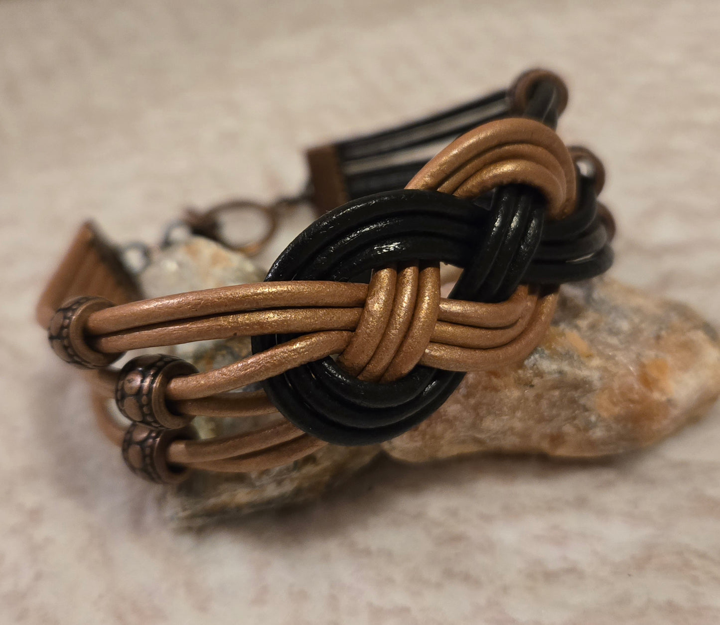 Rose gold and black celtic knot leather bracelet