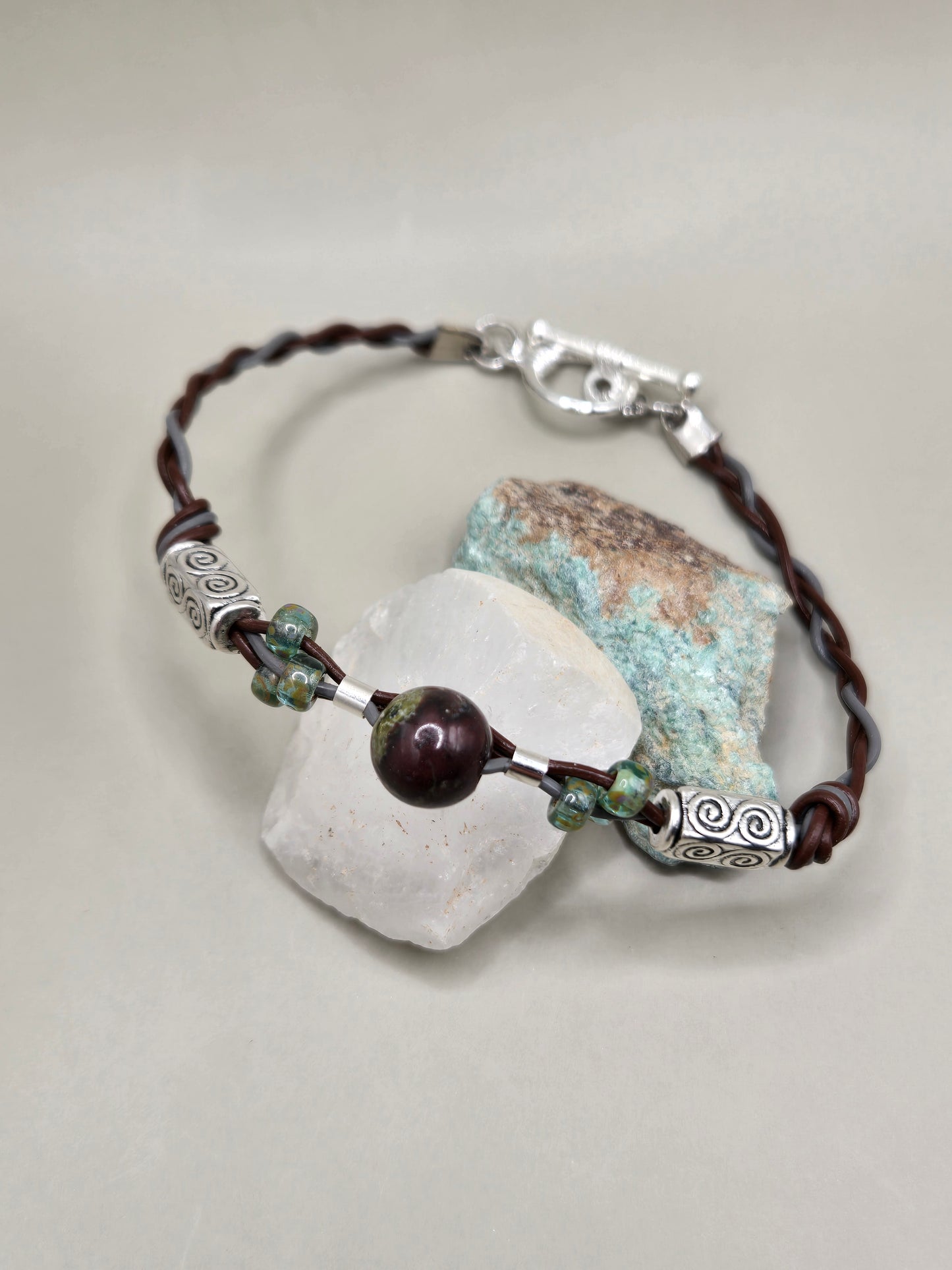 Gray and brown braided leather bracelet with beads