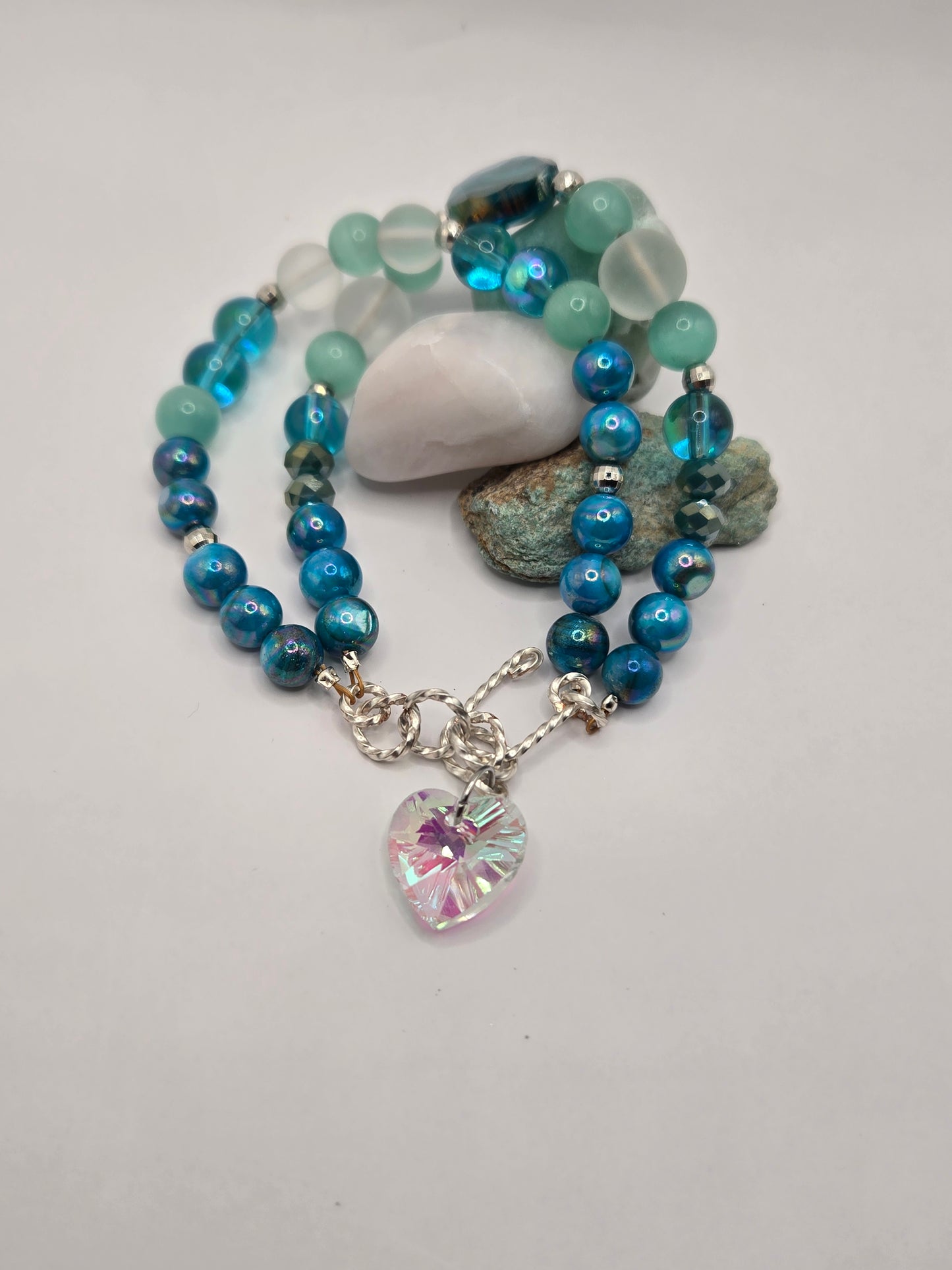 Double satin gold wire bracelet with Aqua glass beads and a glass heart charm