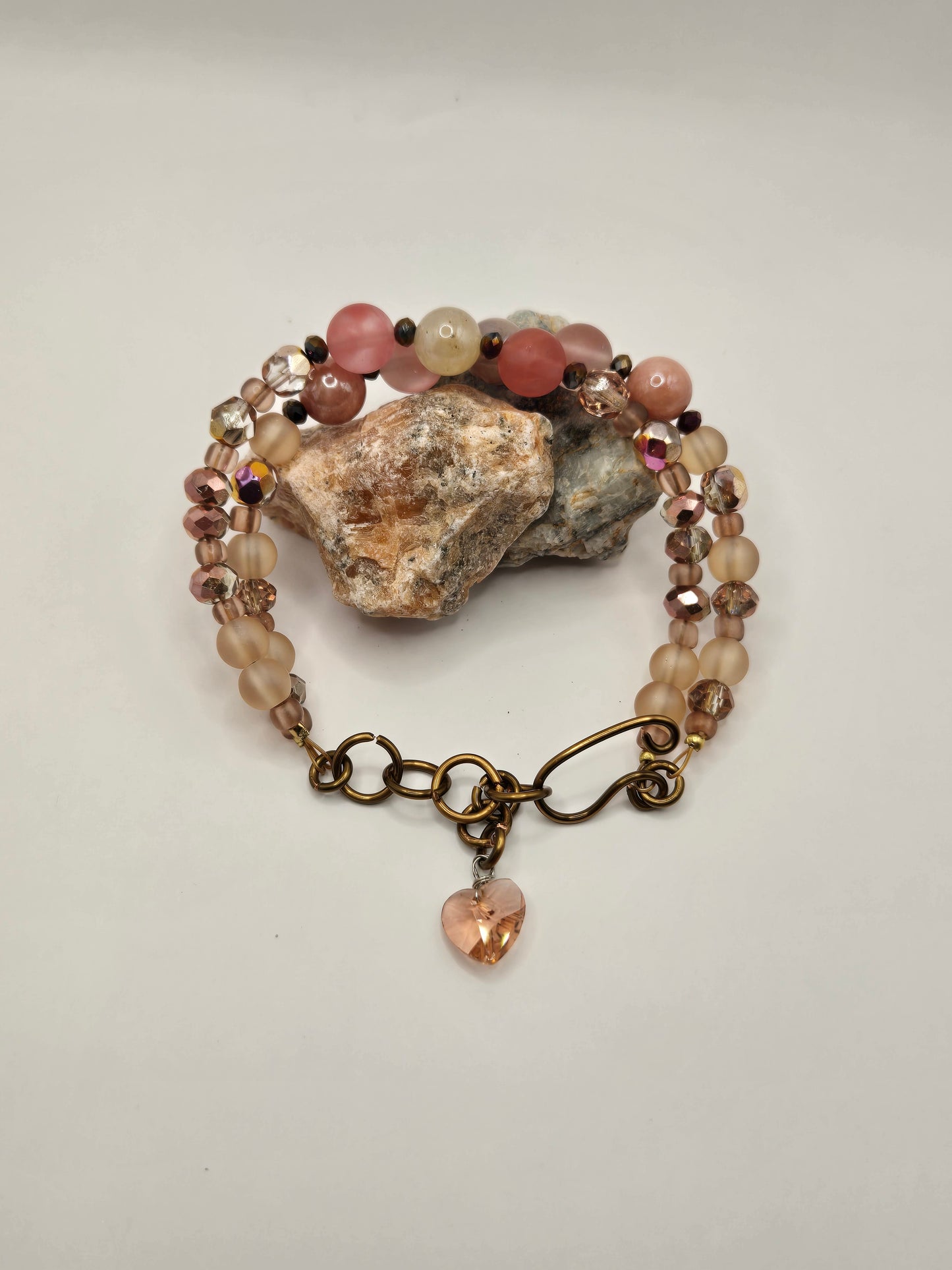 Double strand wire bracelet with glass beads and a heart glass charm