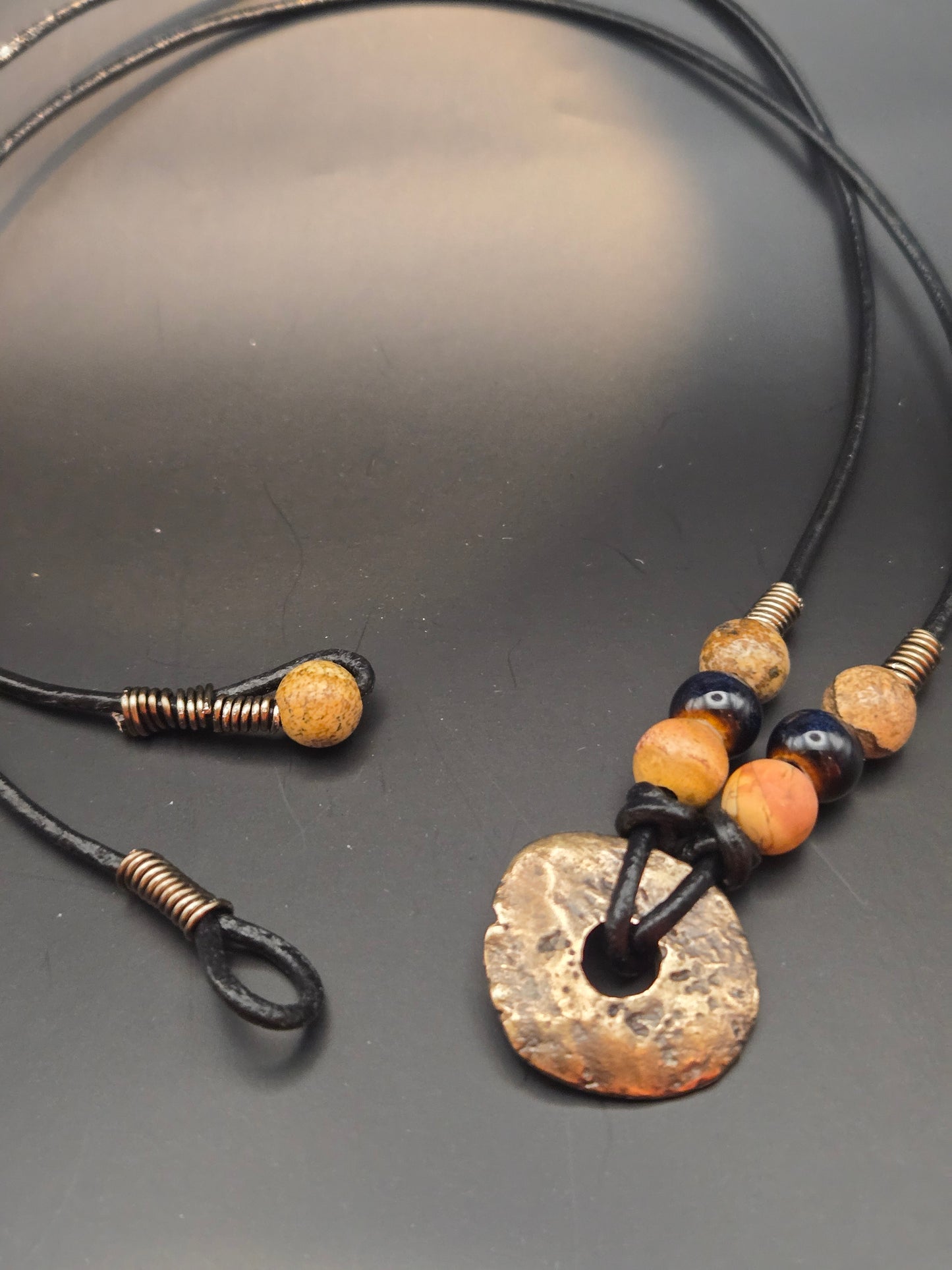 Antique brass disk leather pendant