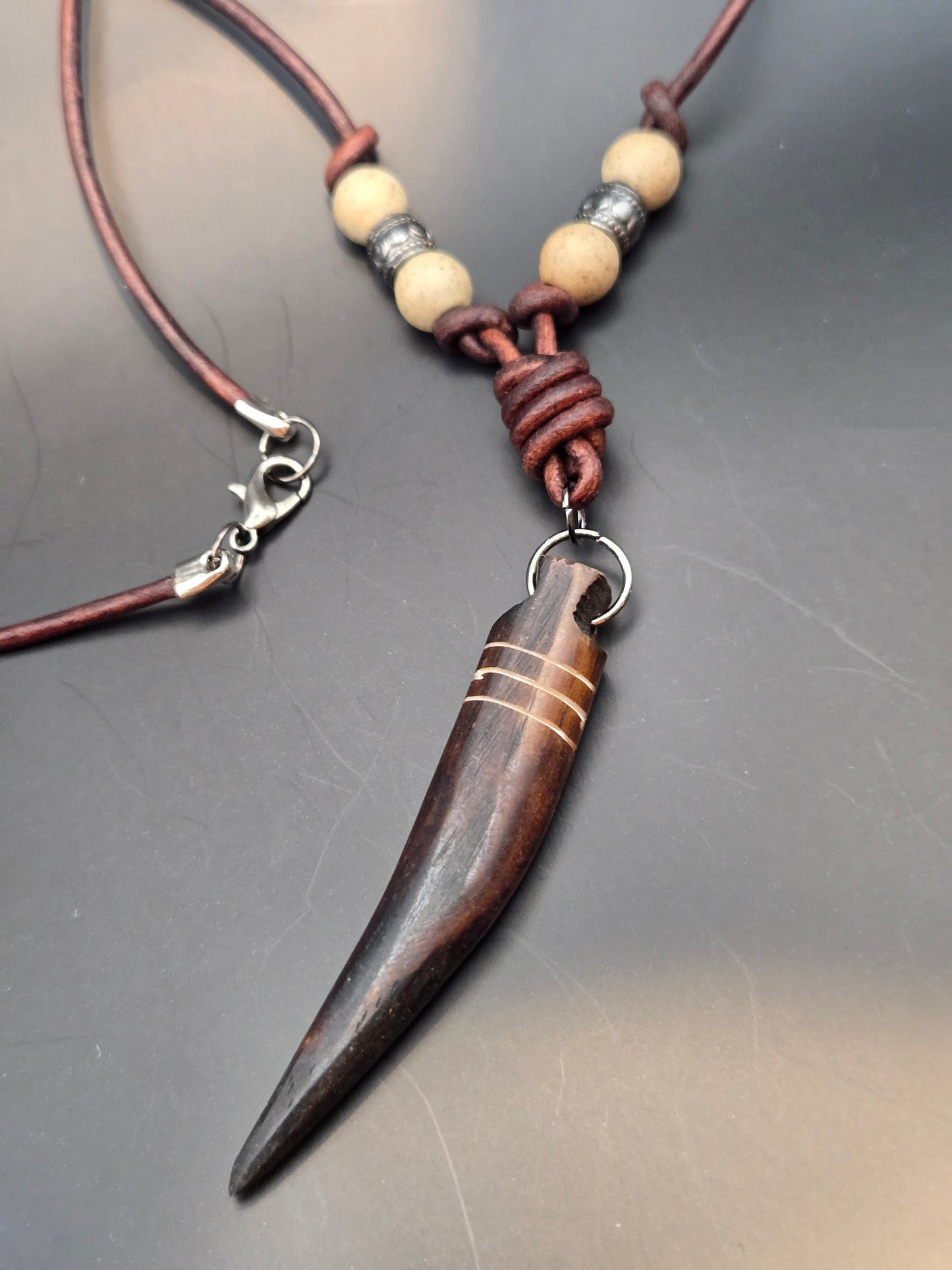 African brown bone carved horn leather pendant