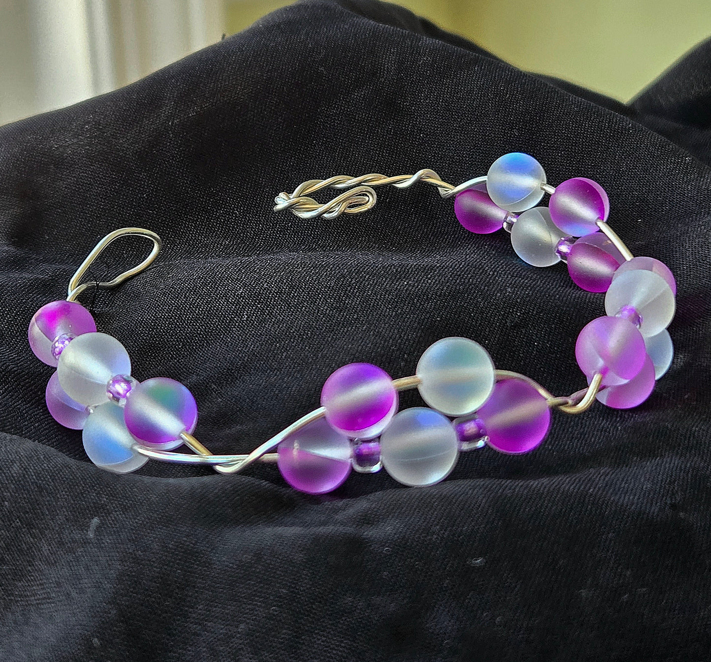 Silver wire bracelet with Rainbow/Purple glass beads