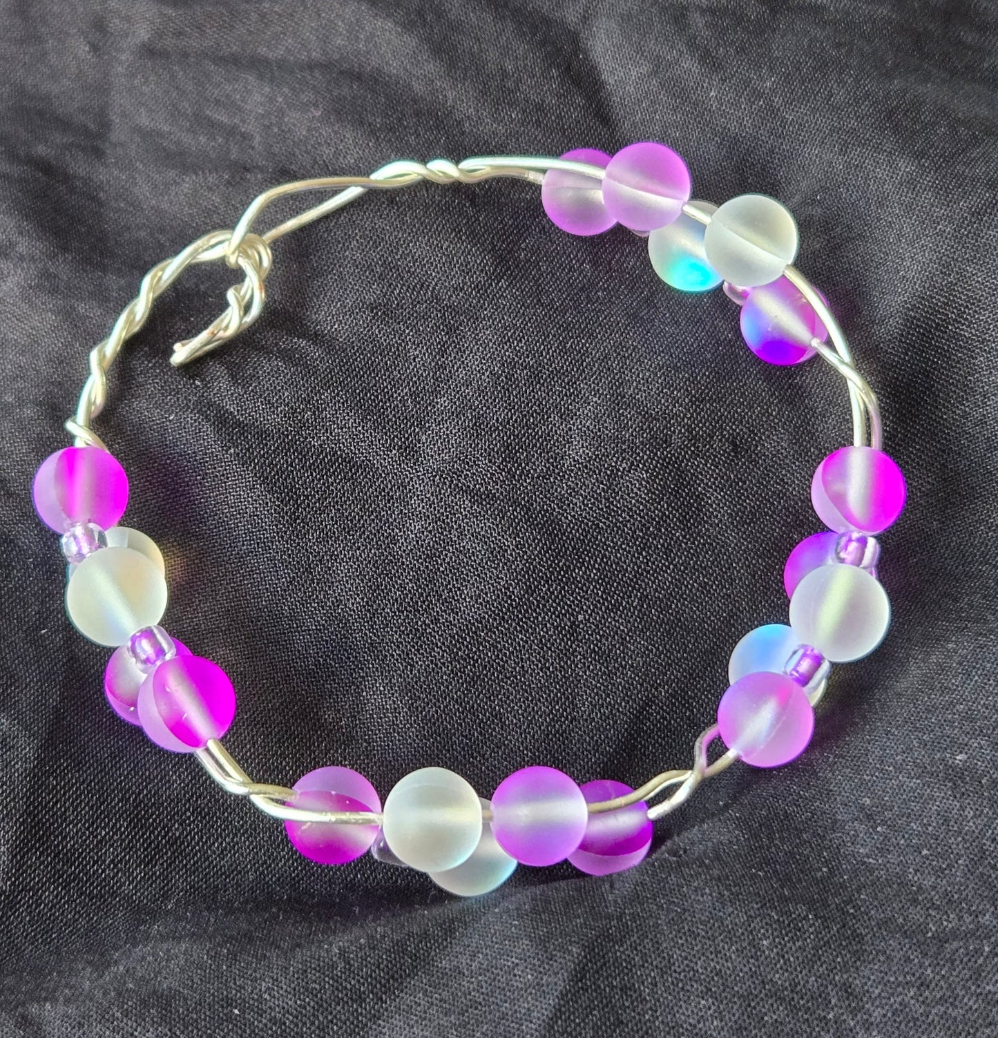 Silver wire bracelet with Rainbow/Purple glass beads