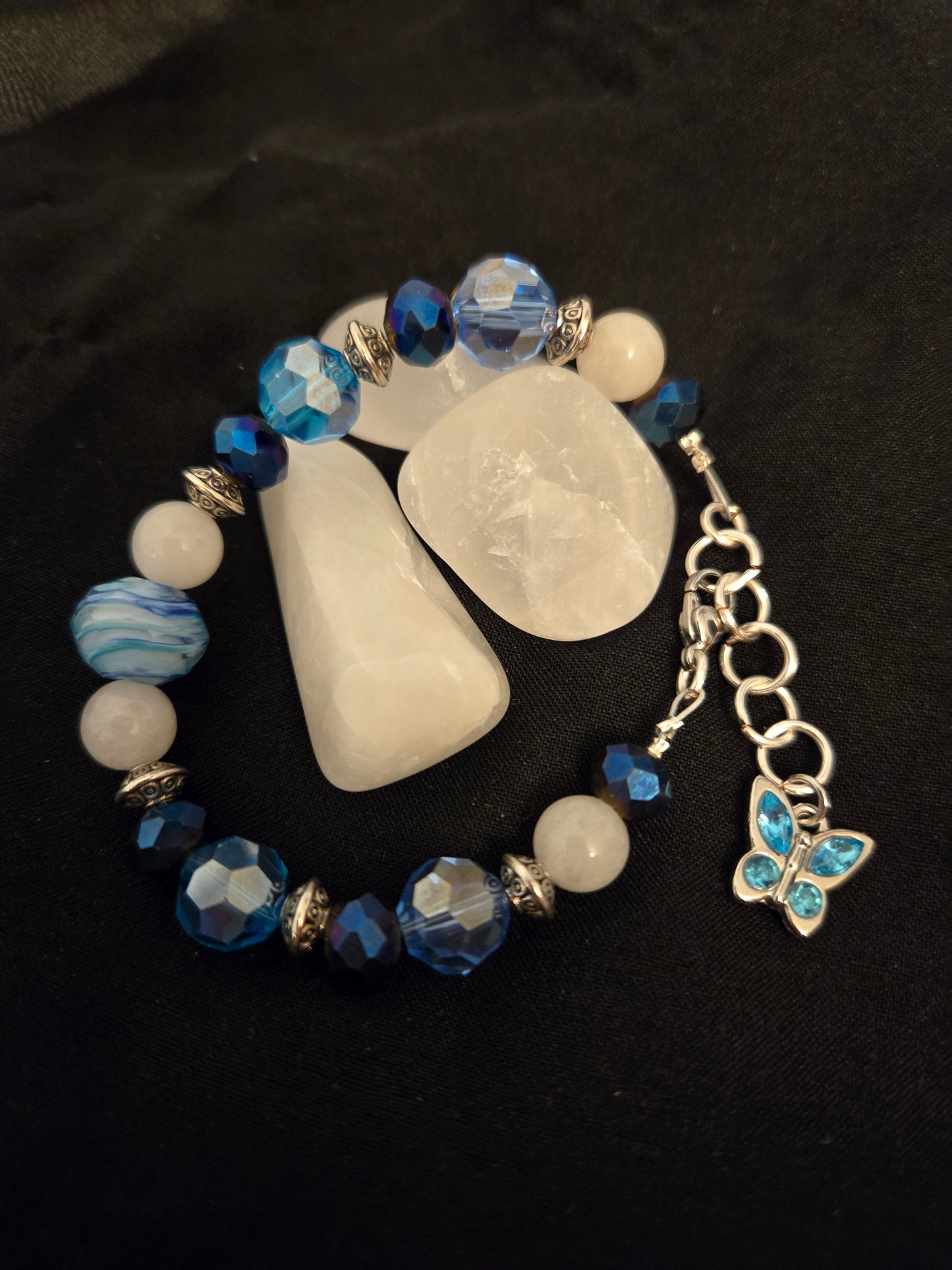 Satin wire bracelet with Blue faceted glass beads and butterfly charm