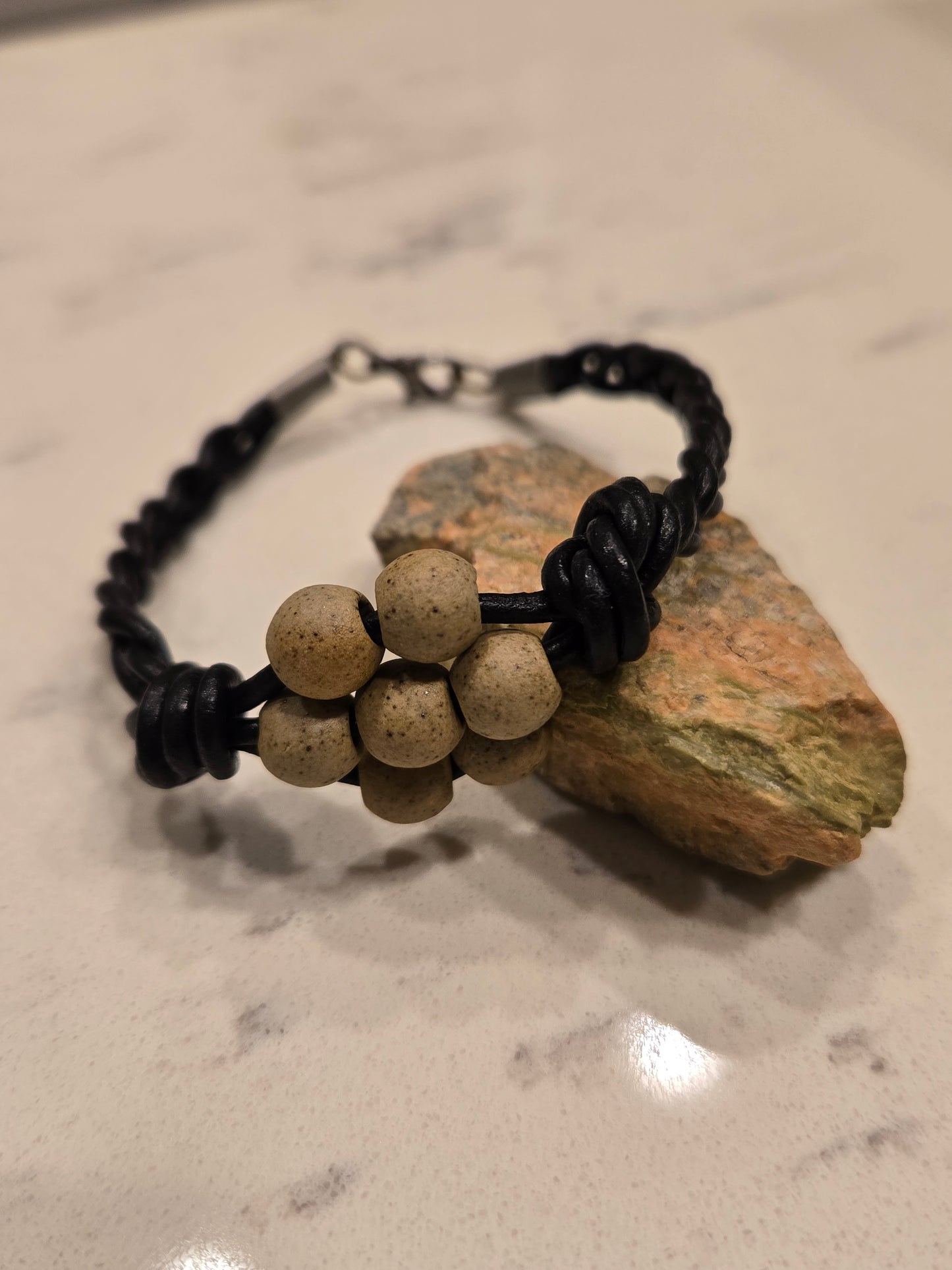 Black braided leather bracelet with porcelain beads