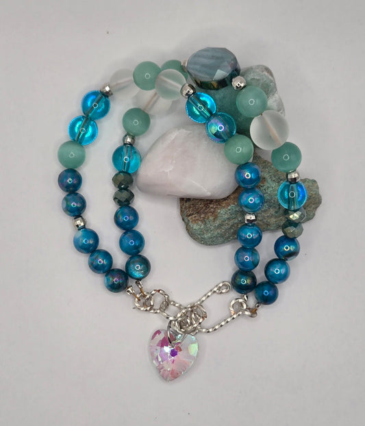 Double satin gold wire bracelet with Aqua glass beads and a glass heart charm