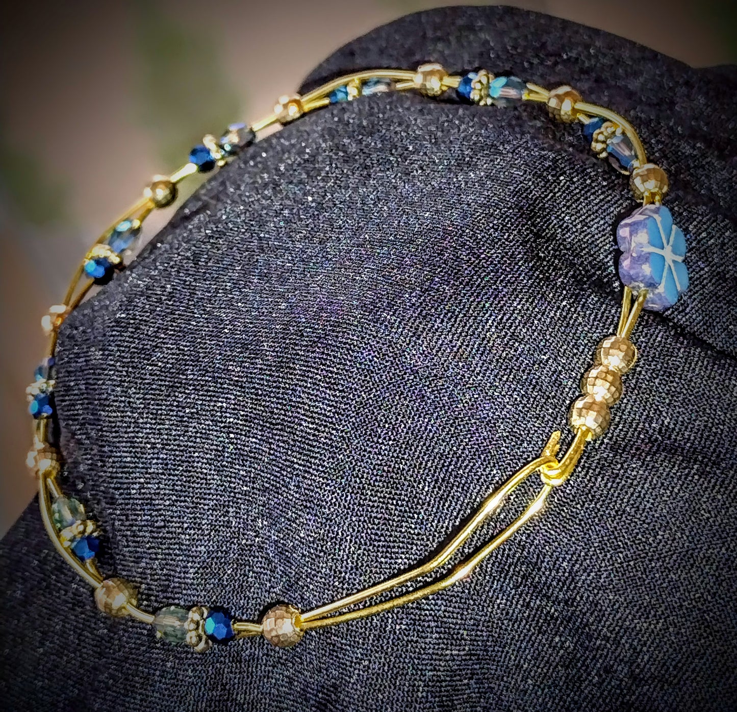 Twisted Brass wire bracelet with Blue faceted glass beads