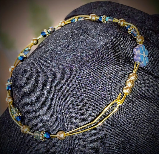 Twisted Brass wire bracelet with Blue faceted glass beads