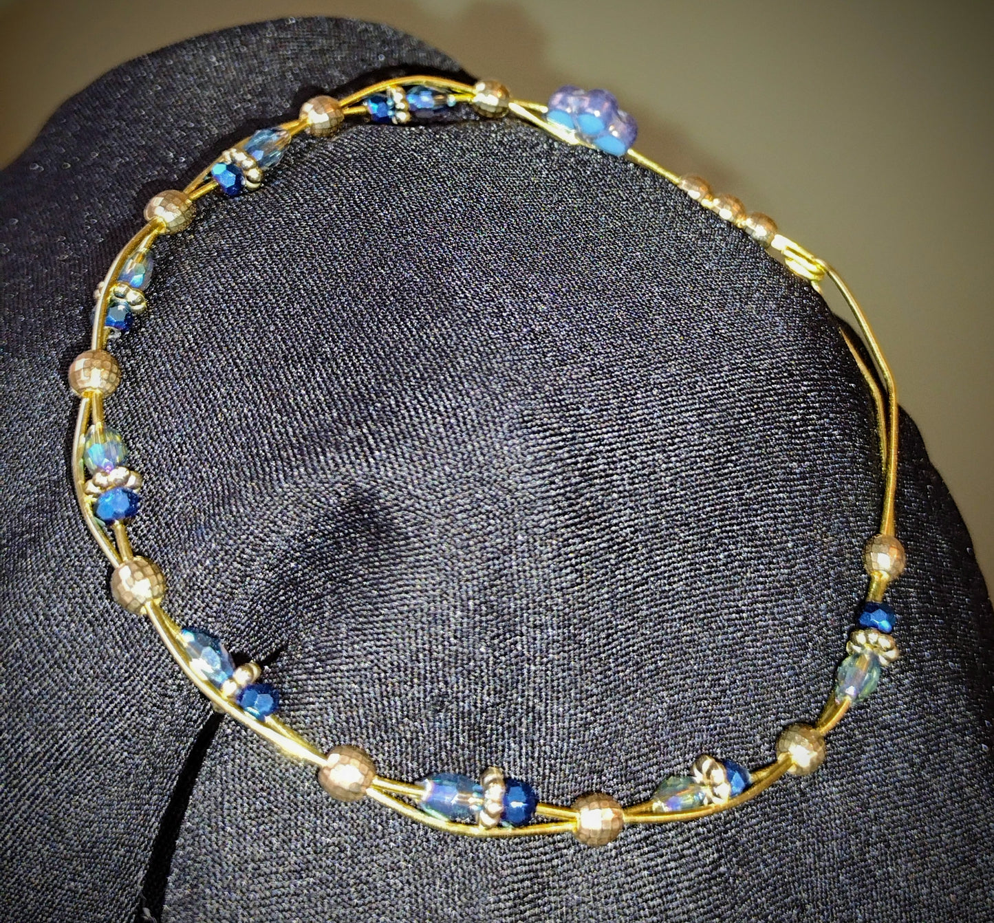 Twisted Brass wire bracelet with Blue faceted glass beads