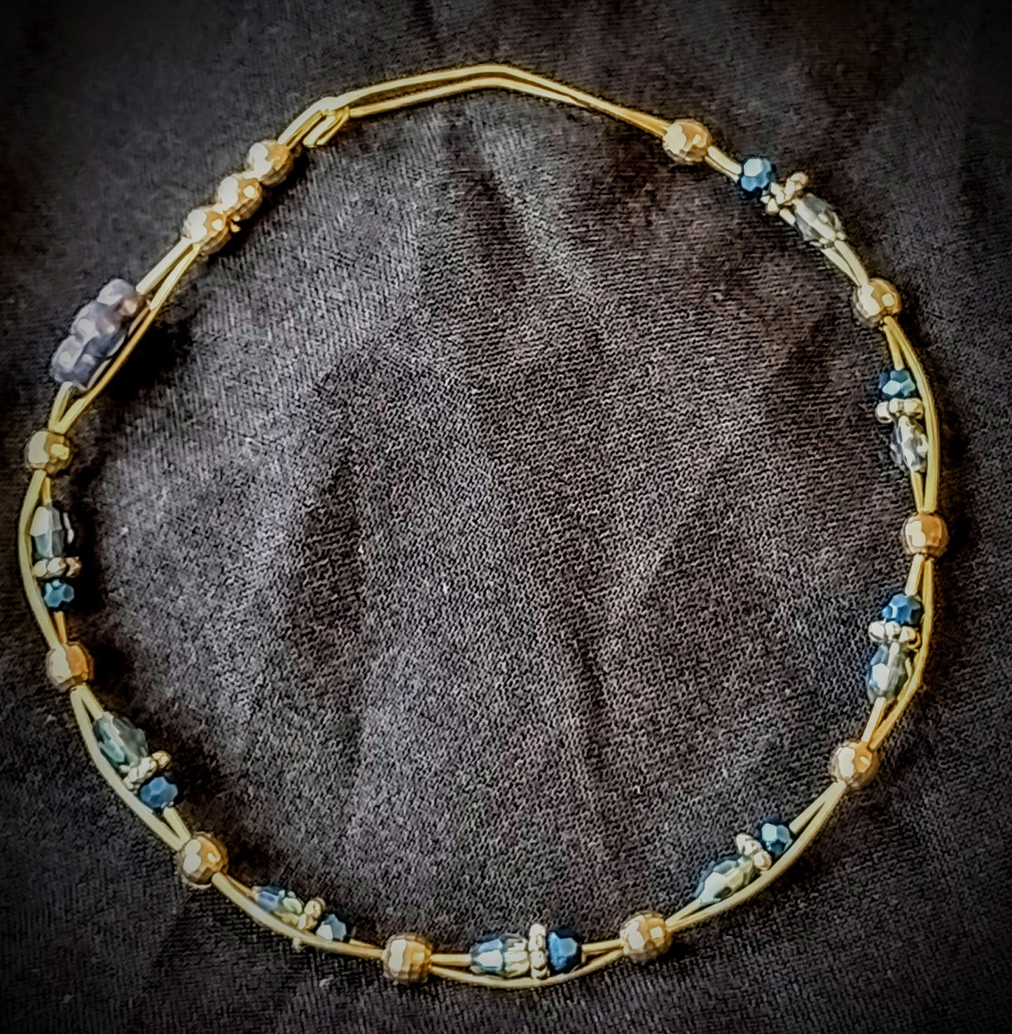 Twisted Brass wire bracelet with Blue faceted glass beads