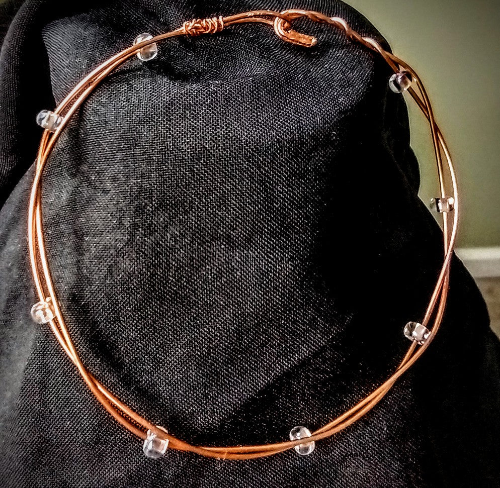 Copper wire bracelet with clear glass seed beads