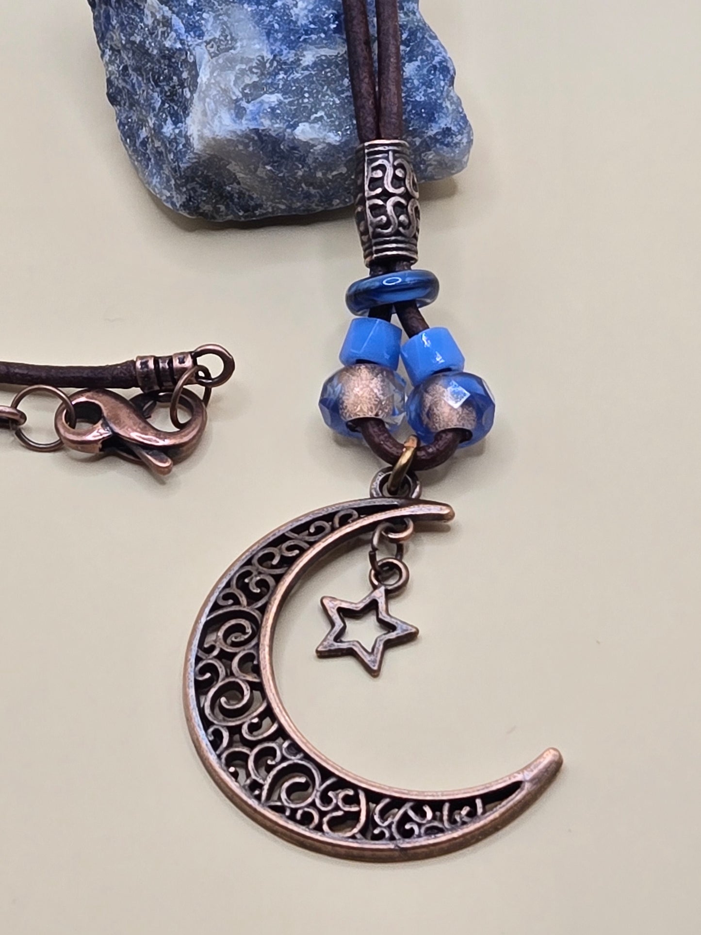 Copper moon crescent leather pendant