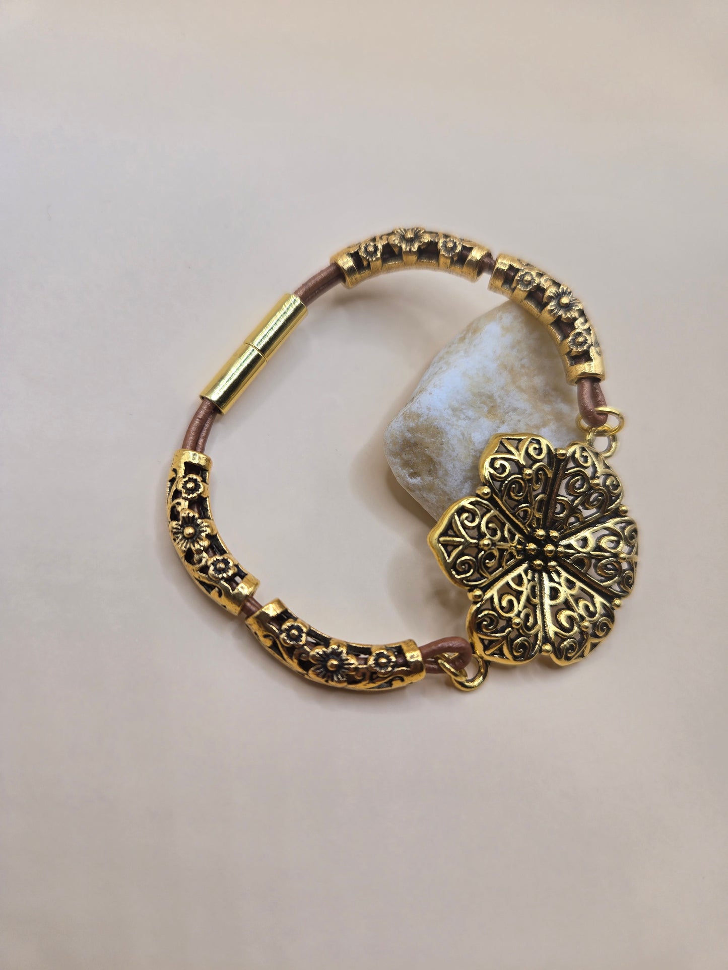Leather and gold accents with gold flower focal magnetic bracelet