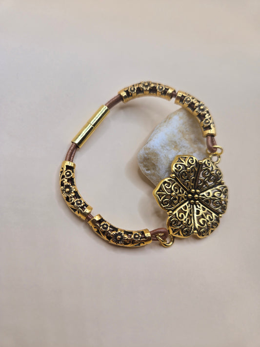 Leather and gold accents with gold flower focal magnetic bracelet